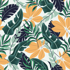 Trend seamless tropical pattern with beautiful plants and leaves on delicate background. Seamless pattern with colorful leaves and plants.  Colorful stylish floral.