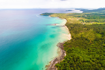 Tropical rainforest sea beach with mountain of palm tree