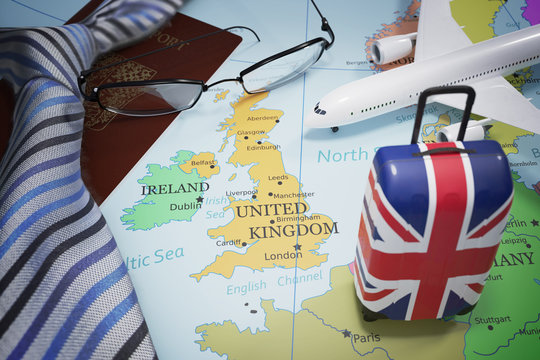 Vacation to Great Britain and tourism concept. Suitcase with United Kingdom flag. 3D rendered illustration.