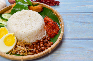 Nasi Lemak is commonly found food in Malaysia, Brunei and Singapore. It is an unofficial national food in Malaysia. Selective focus.