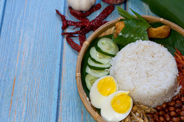 Nasi Lemak is commonly found food in Malaysia, Brunei and Singapore. It is an unofficial national food in Malaysia. Selective focus.
