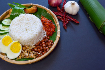 Nasi Lemak is commonly found food in Malaysia, Brunei and Singapore. It is an unofficial national food in Malaysia. Selective focus.