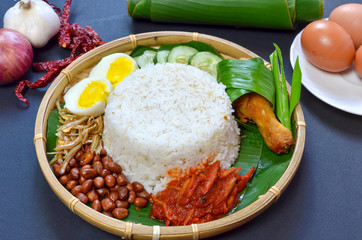 Nasi Lemak is commonly found food in Malaysia, Brunei and Singapore. It is an unofficial national food in Malaysia. Selective focus.