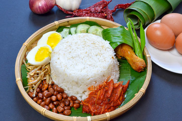 Nasi Lemak is commonly found food in Malaysia, Brunei and Singapore. It is an unofficial national food in Malaysia. Selective focus.