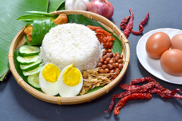 Nasi Lemak is commonly found food in Malaysia, Brunei and Singapore. It is an unofficial national food in Malaysia. Selective focus.