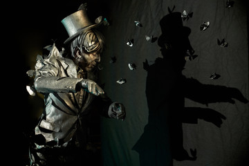 Side view of professional mime performing at pantomime act