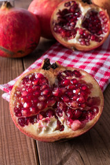 natural pomegranate on rustic wooden background