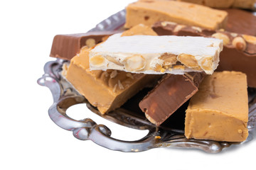 assorted nougat in tray isolated on white