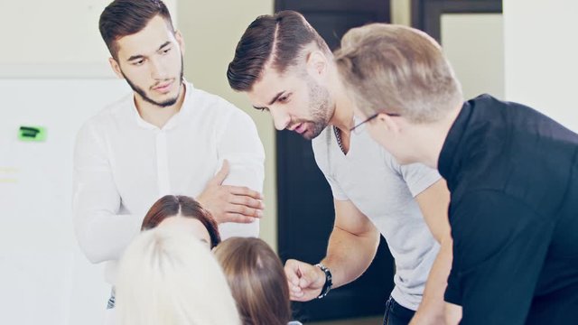 Young employees during the work process. Question and not perception on the faces The decision came to a standstill Deadline and Hopeless Situation