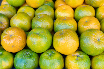 orange fruit stacked on the marketplace at Taiwan
