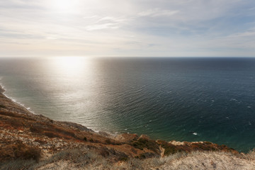 Beautiful sunset view on the sea coast from the top of the hill.