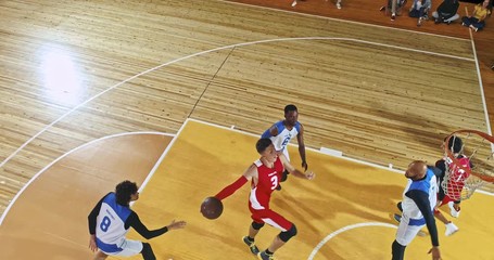 Drone footage of basketball players on big professional arena during the game. Tense moment of the game. Celebration - Powered by Adobe