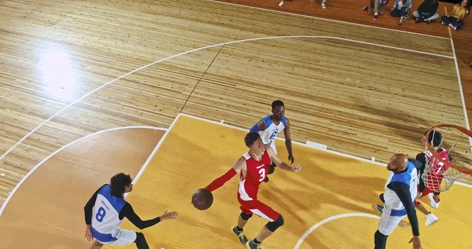 Drone footage of basketball players on big professional arena during the game. Tense moment of the game. Celebration - Powered by Adobe
