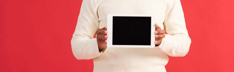 panoramic shot of man holding digital tablet with blank screen