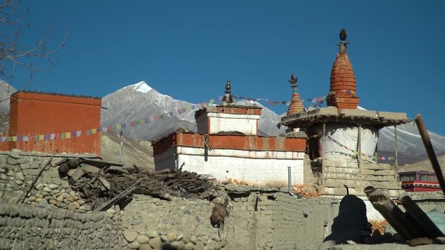 beautififul scenery in the Himalaya mountains of a stupa in an old village
