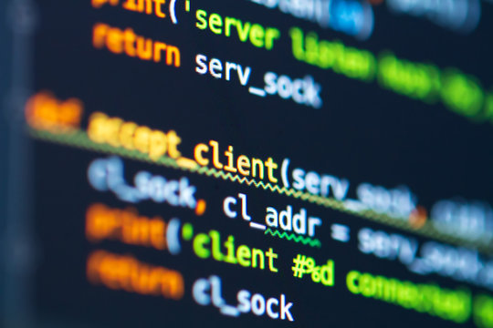 Program code on screen of laptop. Coding process. Software development. Developer programming web application server