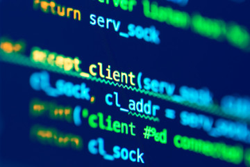 Code of programming language on the screen of laptop. Software development. Programmer coding web application client server. Developer of program code. Coding
