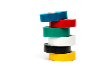 Rolls of insulation adhesive tape, multi colored ribbons on a white background.