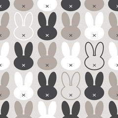 Cute Scandinavian Easter Bunny seamless pattern with primitive geometric silhouettes of rabbit head in neutral colors