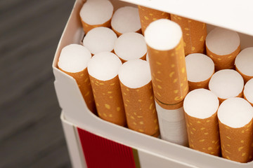 peel it off Cigarette pack prepare smoking a cigarette. Packing line up.  photo filters Natural light.