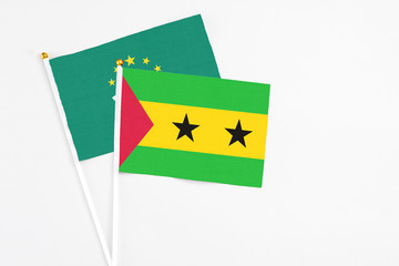 Sao Tome And Principe and Macao stick flags on white background. High quality fabric, miniature...