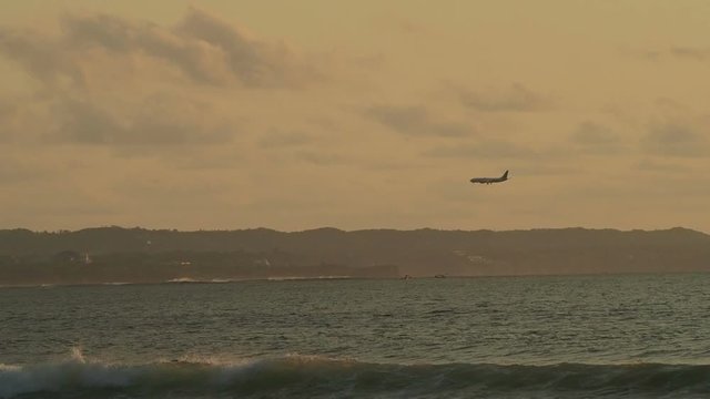 Airplane landing at the airport near Cuta beach, Bali, Indonesia