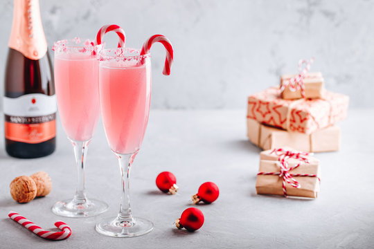 Festive Christmas Drink Peppermint Bark Mimosa Cocktail With Champagne Or Prosecco And Candy Cane