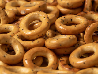 pattern with bread bagels with poppy seeds close-up