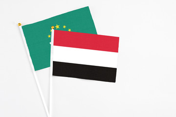 Yemen and Macao stick flags on white background. High quality fabric, miniature national flag. Peaceful global concept.White floor for copy space.