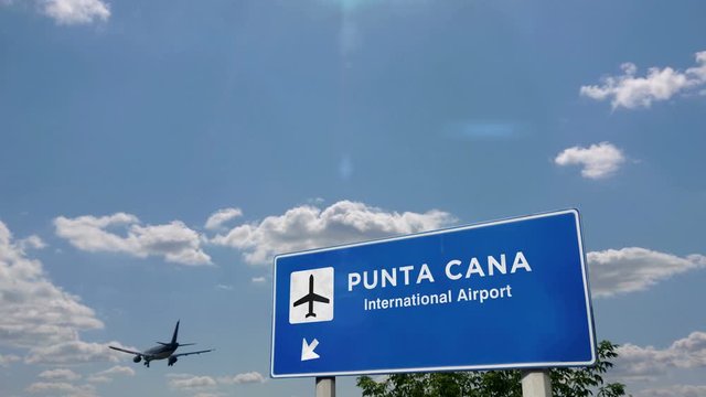 Jet airplane landing in Punta Cana, Dominican Republic. City arrival with airport direction sign. Travel, business, tourism and transport concept. 3D rendering animation.