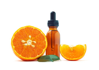 Serum extracted from oranges in glass bottles and oranges on white background