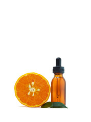 Serum extracted from oranges in glass bottles and oranges on white background