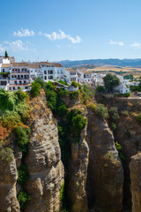 Fototapeta na wymiar Scenic viewpoint to canyon, valley and mountains from Ronda, small ancient white town in Andalusia, Spain