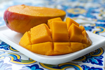 Fresh ripe mango fruit, new harvest on mangoes in Tropical Coast near Malaga, Andalusia, Spain