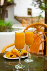 Healthy breakfast with two glasses of freshly squeezed orange juice