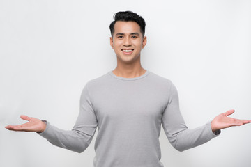 Happy young asian man celebrates with two hand in the air on isolate white background.