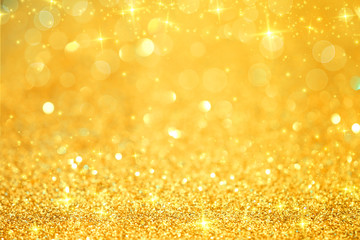 Luxury gold glitter with bokeh background, de-focused.