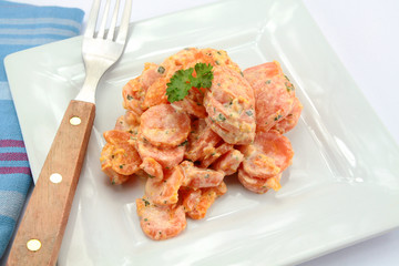 carrot with fresh cream on a plate