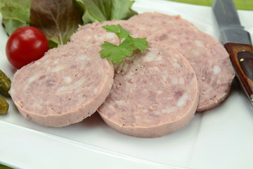 slices of garlic sausage on a plate
