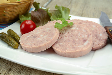 slices of garlic sausage on a plate