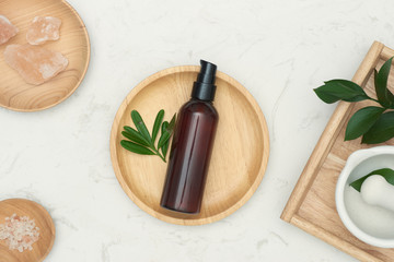 Fototapeta na wymiar natural cosmetic skincare bottle container and organic green leaf. Beauty product concept