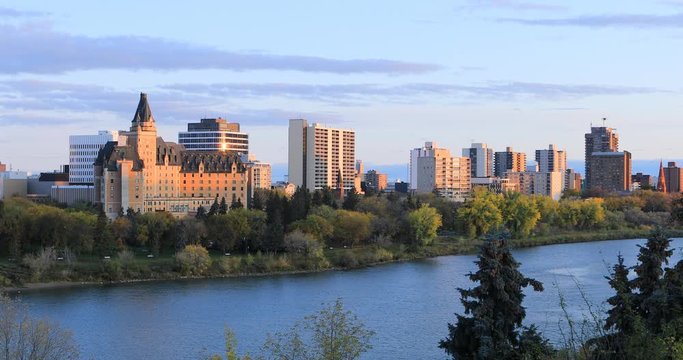 View of Saskatoon, Canada cityscape by river 4K