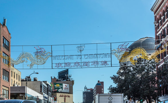 chinatown with shops with chinese letters and pegasus in Chinatown, New York