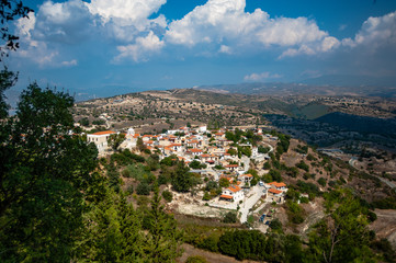 Fototapeta na wymiar From the village of Dora, roads go down to the valley, where there are many vineyards, olive groves and fields for growing vegetables. 