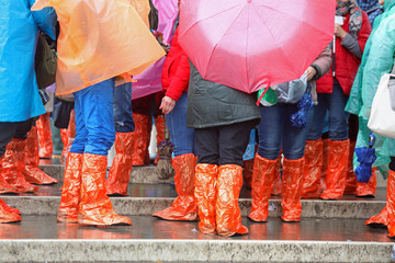 people with rain coat and gaiters during flood