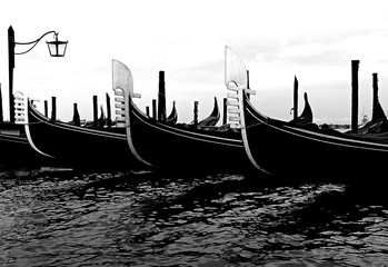 Fototapeta na wymiar Three moored gondolas boats in Venice