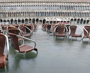 brown chairs on the water during the record flood in Venice in I
