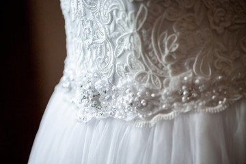 new Wedding dress detail photo. Detail of an elegant white wedding dress