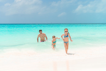 Father and kids enjoying beach summer vacation