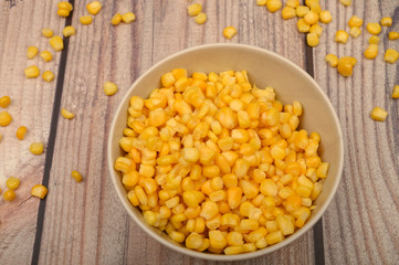 Grains of sweet corn in a plate on the table. Healthy diet. Fitness diet. For a sweet treat. Close up.